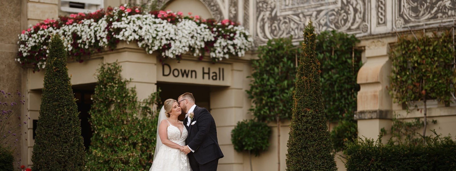 Outdoor Weddings in Essex - Bride and Groom Kissing at Down Hall Venue