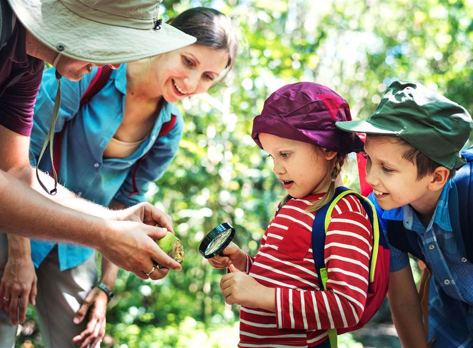 father teaching his daughter how use mag