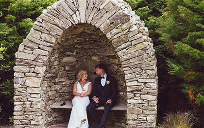 Bride and Groom in Arch