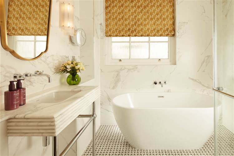 Three bedroom suite  bathroom with bath