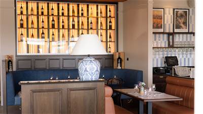 Elegant wine display and cosy dining area at The Lighthouse Bistro