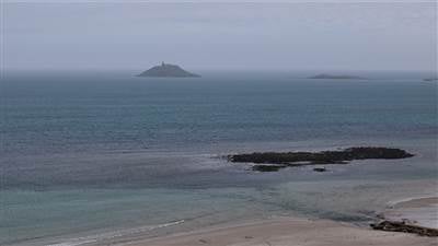 Drone view of The Garryvoe Hotel overlooking the golden beach, Ballycotton Bay, and the stunning Eas