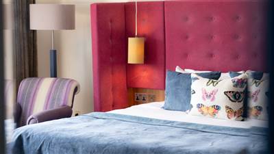 Luxury hotel room with king-size bed at The Garryvoe Hotel in East Cork