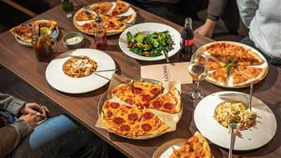 A selection of Pizzas and other foods at Blooms Coffee and Pizza