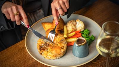 Sunday Roast dinner being served in The London Pub