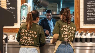 Two servers speaking to a manager in Blooms Coffee and Pizza