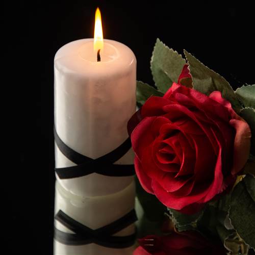 front view lighting candle with red flow