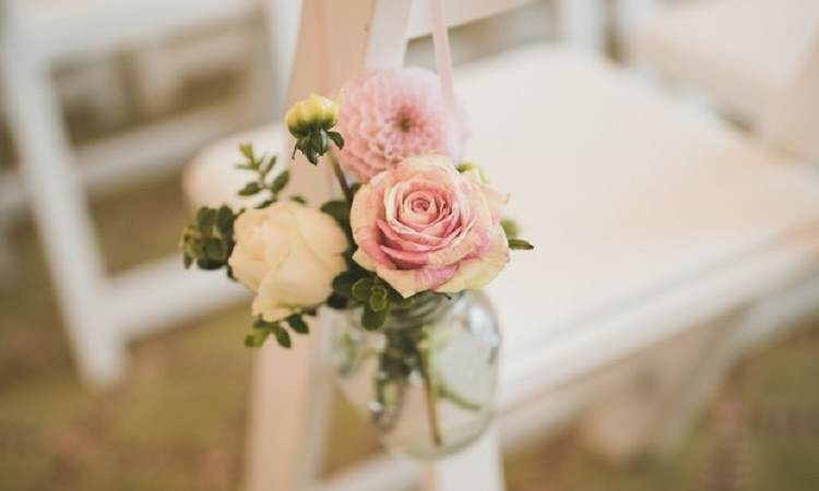 modern wedding pew end flowers