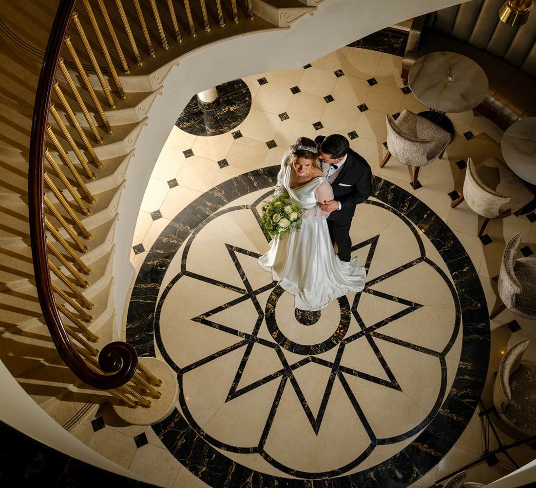 Wedding Couple at Bottom of Staircase 