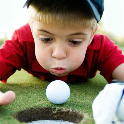 Kid playing golf